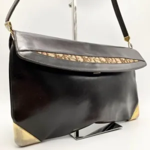 RARE, vintage, Dior, brown leather two-wy clutch/shoulder bag with a brown trotter print interior and accent that peeks through the front