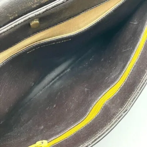 RARE, vintage, Dior, brown leather two-wy clutch/shoulder bag with a brown trotter print interior and accent that peeks through the front